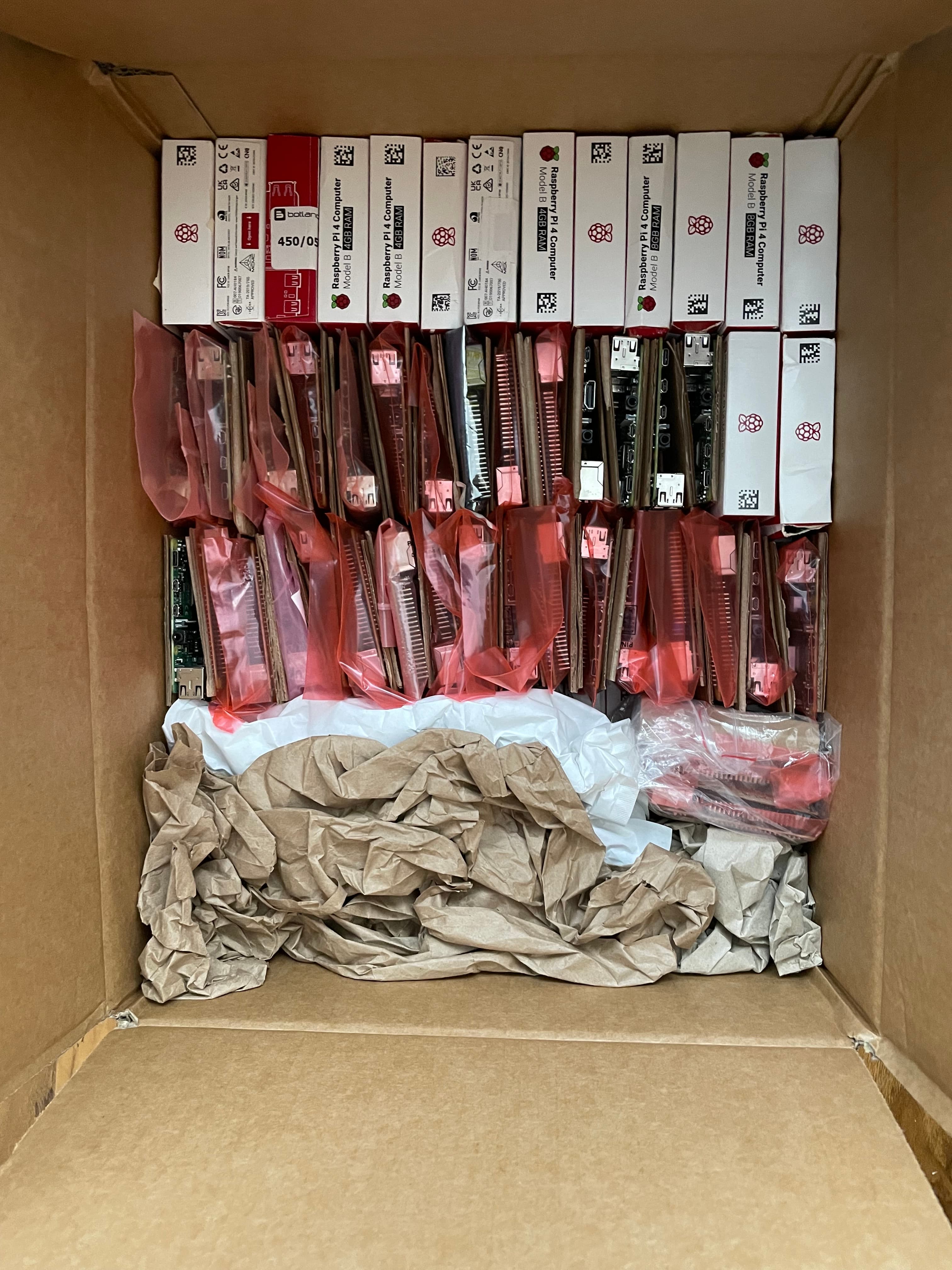 Approximately sixty Raspberry Pi boards from aftermarket returns, some in retail boxes
