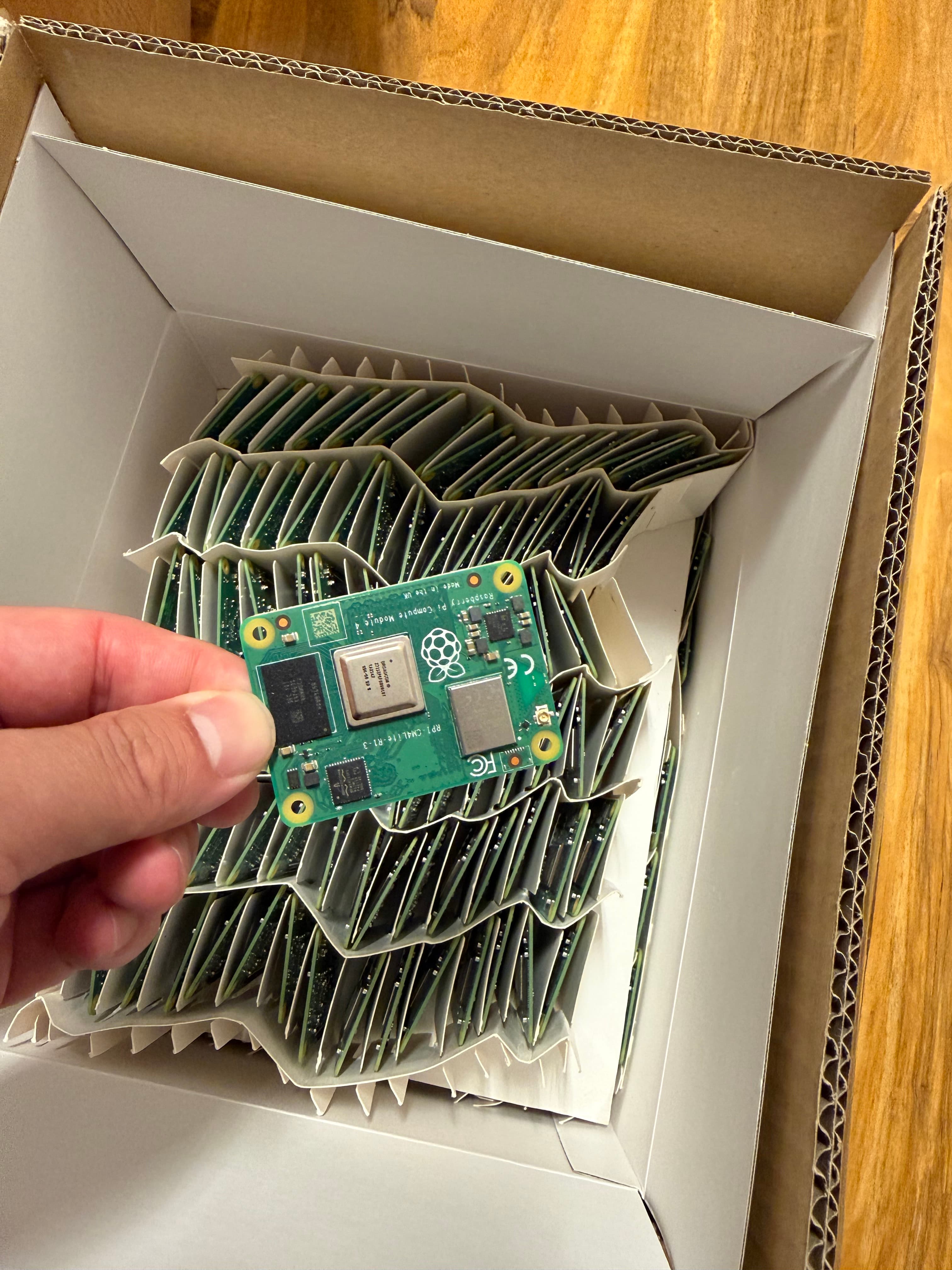 Production-line tray of Raspberry Pi CM4102000 modules, bulk pack, long-discontinued