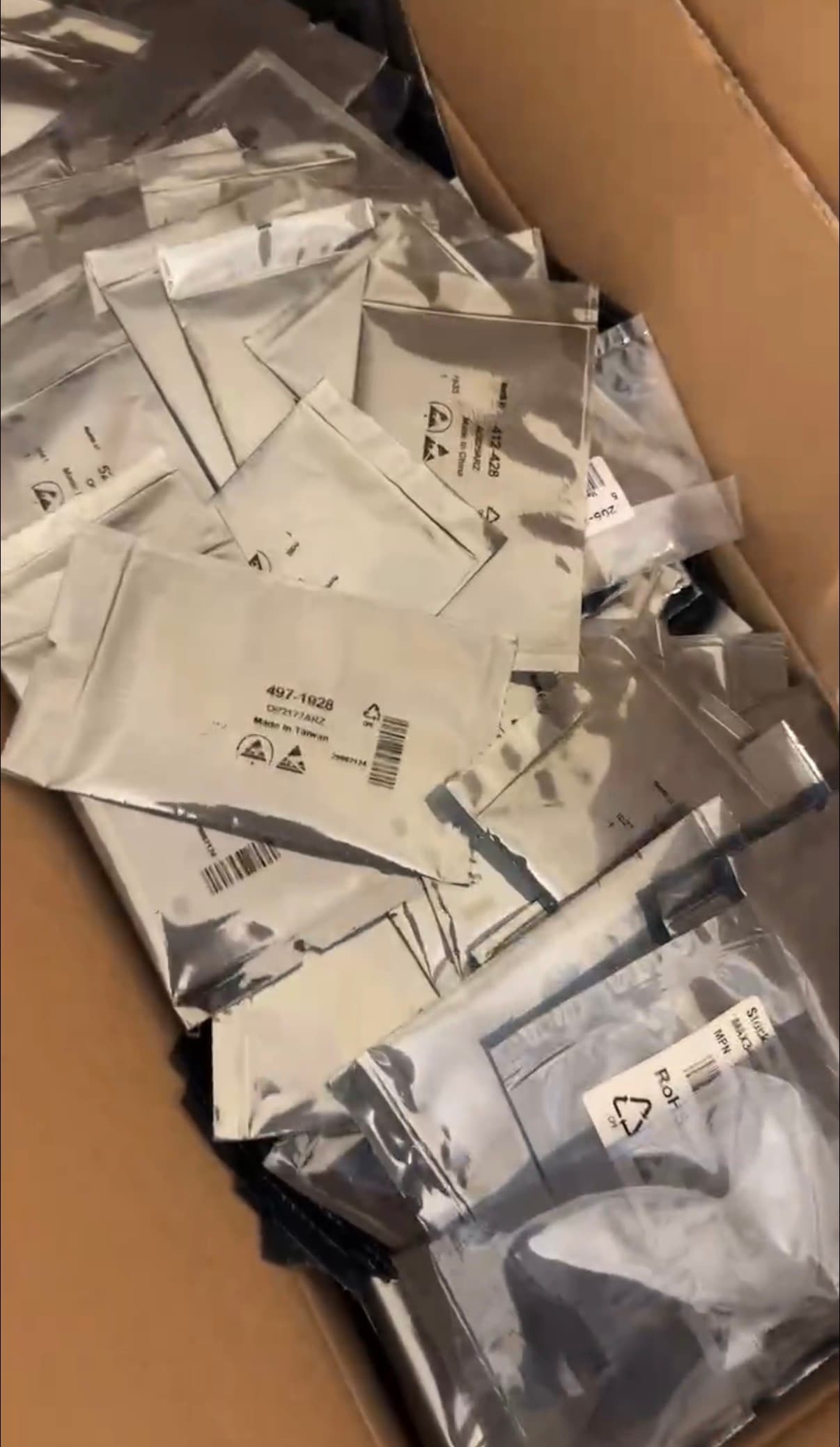 Box full of anti-static bagged electronic components